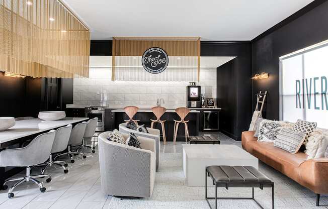 a living room and kitchen with black walls and white floors