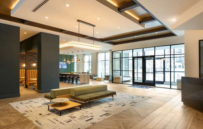 a large lobby with a couch and a coffee table