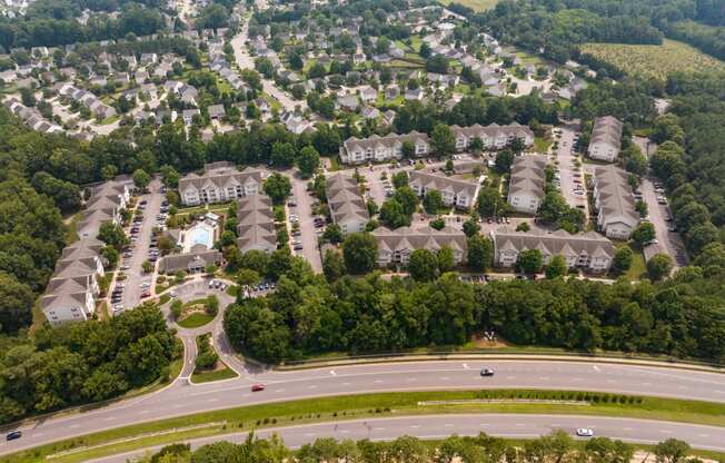 an aerial view of a neighborhood of houses and trees