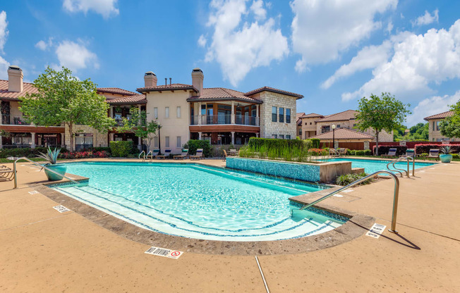 a swimming pool with a building in the background