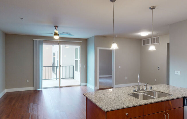 A kitchen with a sink and a counter top.