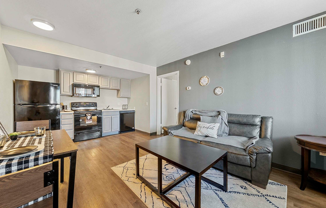 Experience contemporary urban living with this stylish open-plan living room and kitchen space.