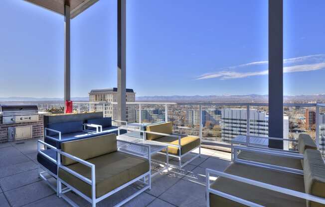 Outdoor community balcony with comfy seating and community grills