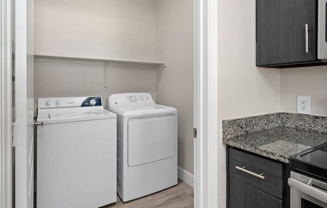 A laundry room with a washer and dryer in it