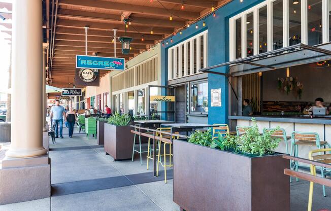 Street-level dining and shaded patios line the walkways at Recreo Cantina—a go-to spot for margaritas, shareable plates, and open-air seating.