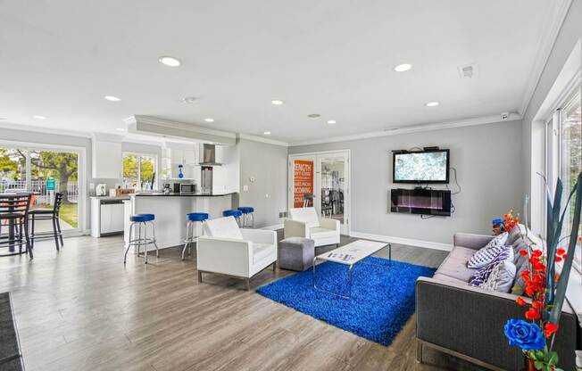 A modern living room with a bar area and a television.