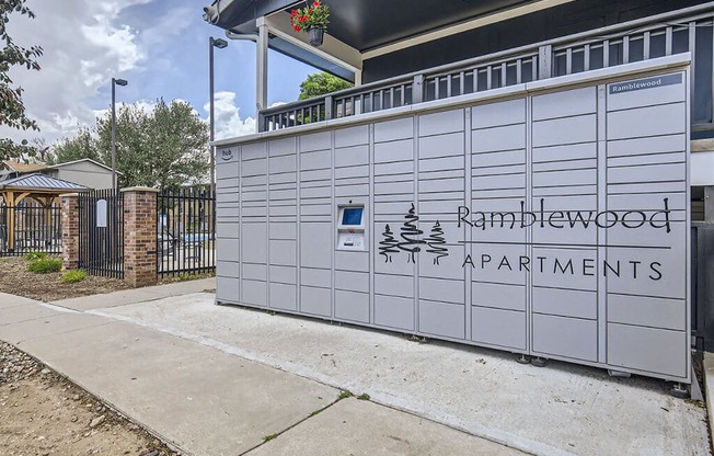 the side of a garage door with the ramirezwood apartments sign