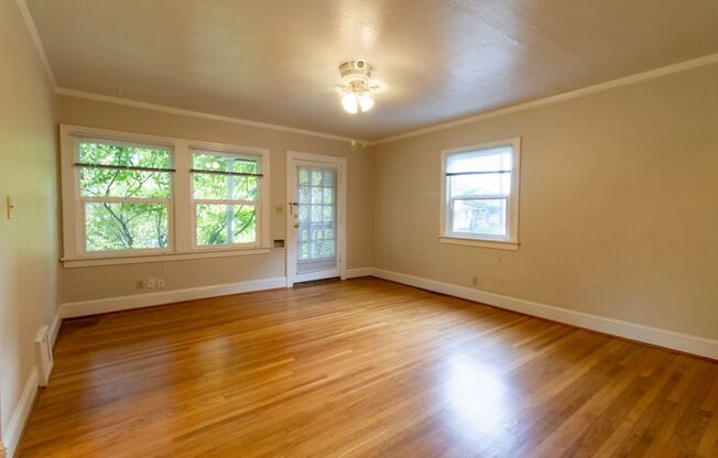 Bright One Bedroom Unit in Fourplex with Vintage Appeal, Original Hardwoods and Garage Available!