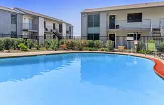 a large pool of water in front of a house