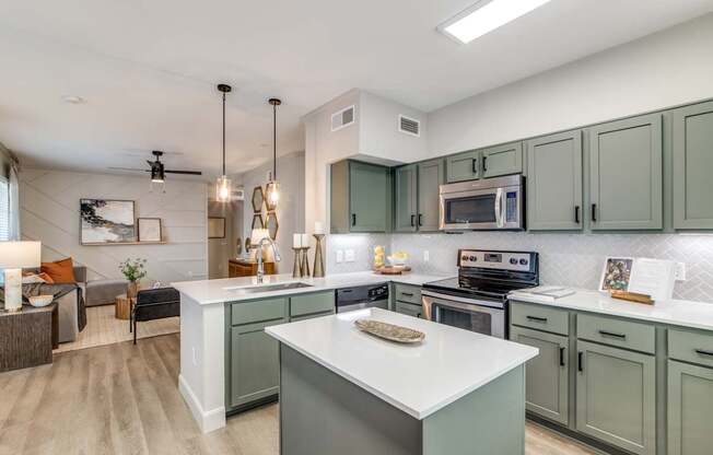 A modern kitchen with a large island in the center.