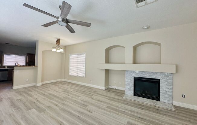 Newly renovated beautiful two story house with brand new vinyl plank flooring, an extra long driveway, and a covered front patio!