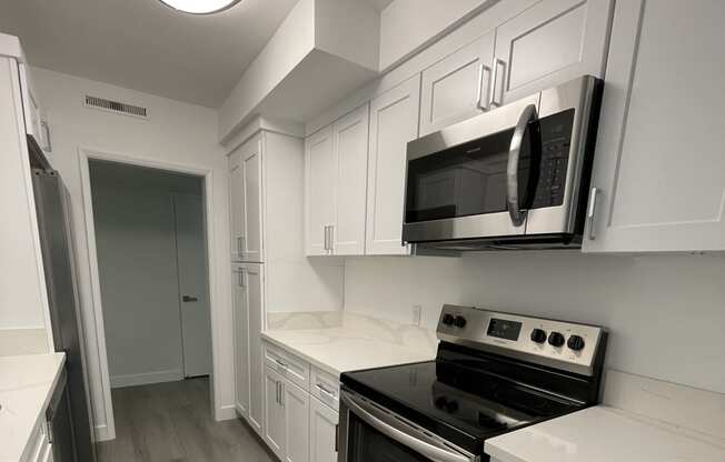 Kitchen with White Cabinets and Stainless Steel Appliances