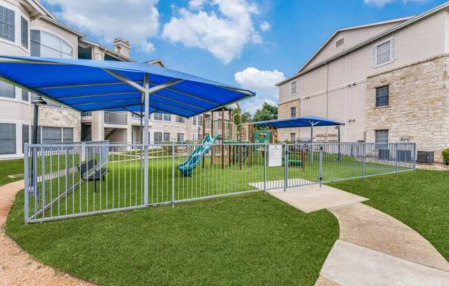 our apartments have a playground and picnic area with umbrellas
