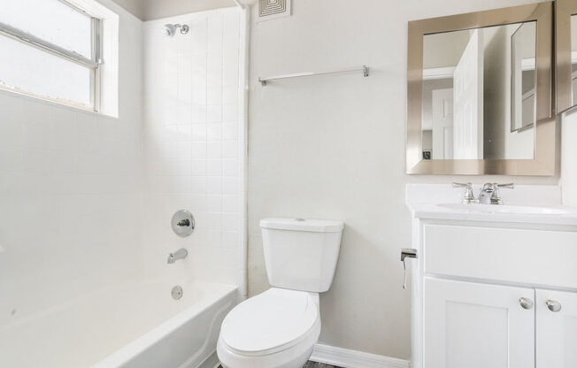 Restroom with a toilet, sink and bathtub_Rolling Hills Apartments