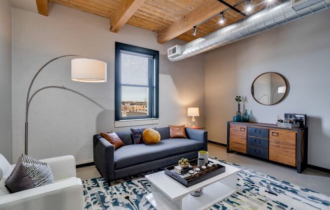 Living room layout with exposed wood beams