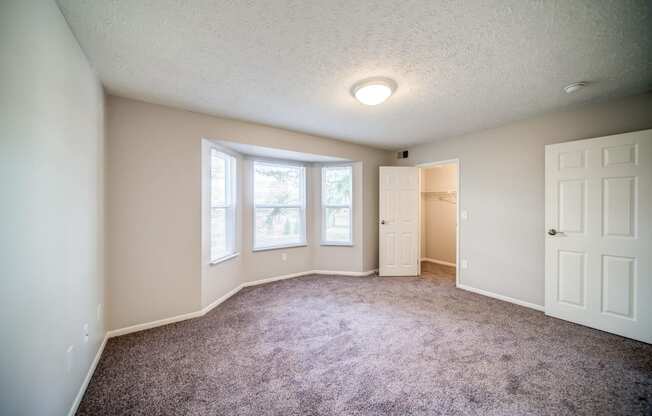 Carpeted Bedroom with Bay Window