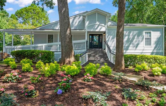 a house with a large tree in front of it