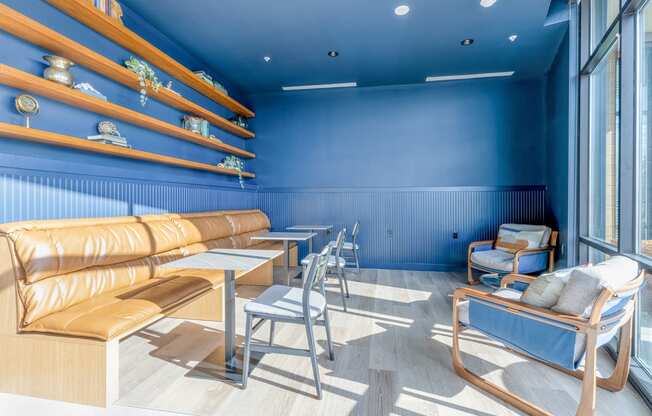 a seating area with a couch chairs and tables at Marina Square, Washington