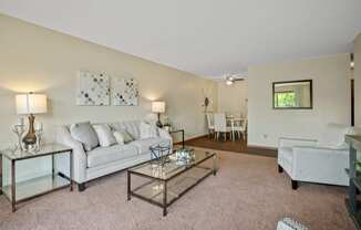 a living room with a couch and a chair