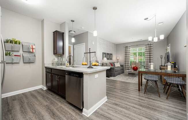 an open kitchen and living room with a table and chairs