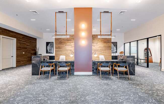 A modern leasing office with a long table and chairs.