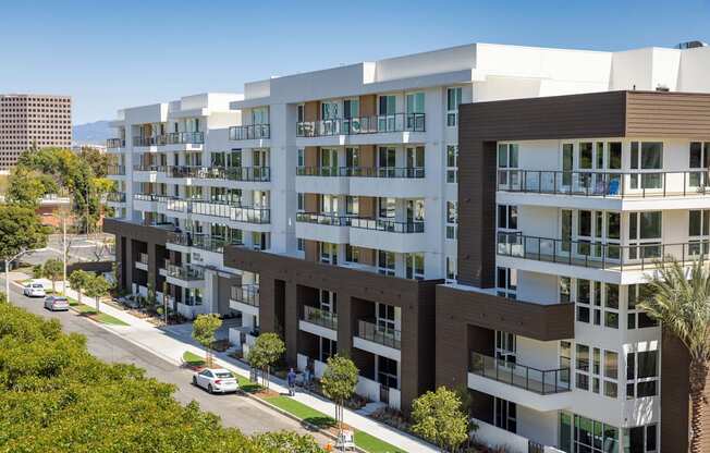 A modern apartment building with balconies and multiple floors. at Elements Apartments*, California