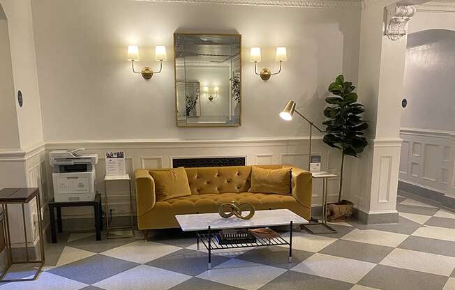 a living room with a checkered floor and a yellow couch