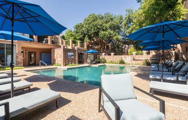 This is a photo of the pool area at The Brownstones Townhome Apartments in Dallas, TX.