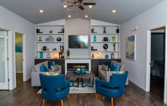 a living room with a couch and chairs and a tv