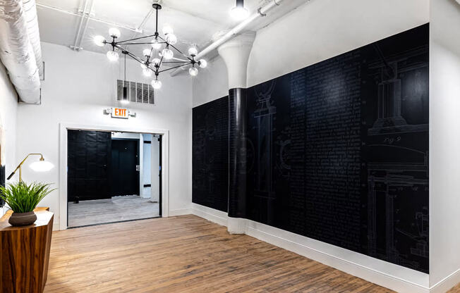 a large room with a black wall and a door