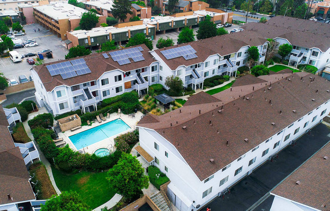 Aerial drone view of roof showcasing solar panels for a low carbon footprint.