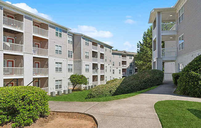 Exterior Community Buildings and Landscape at Retreat at Stonecrest Apartments located in Lithonia, GA.