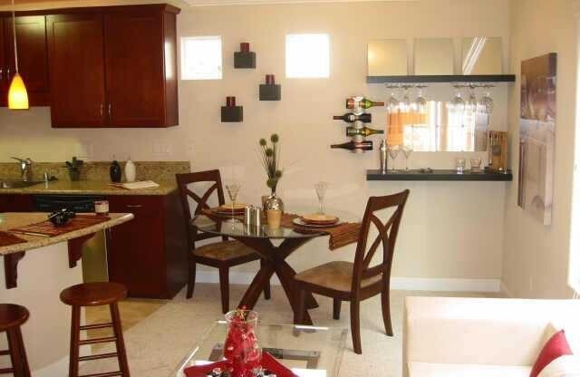 Beautiful upscale top floor 1 bedroom & 1 bath open concept condo - bright end unit with one reserved parking space. Amenities include: granite kitchen and bath, cherry wood cabinets, SS appliances, in unit washer & dryer, mirrored closet with custom cont