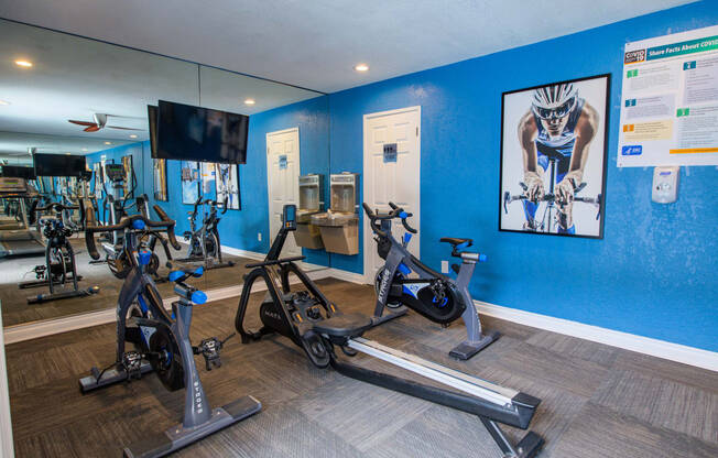 the gym at the enclave at woodbridge apartments in sugar land, tx at Dwell Apartment Homes, Riverside, California