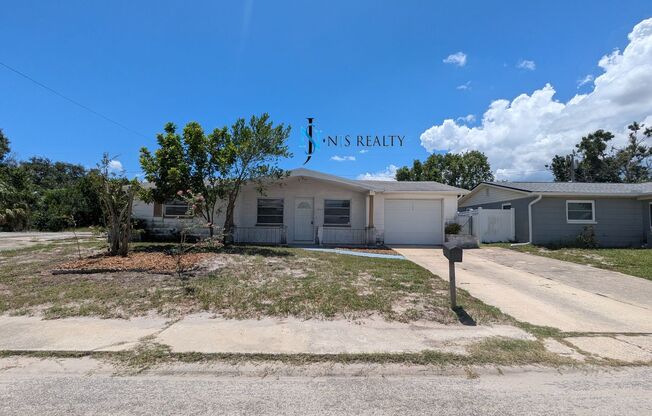 Must See 3/2/1 over 1000sf with tile/laminate floors, fresh paint, fenced yard and large living room!!