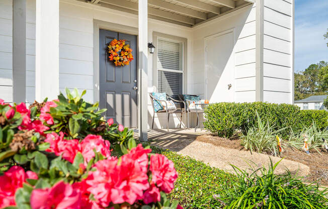 decorated front porch entrance of an apartment at 701 South Apartments in Mobile, AL