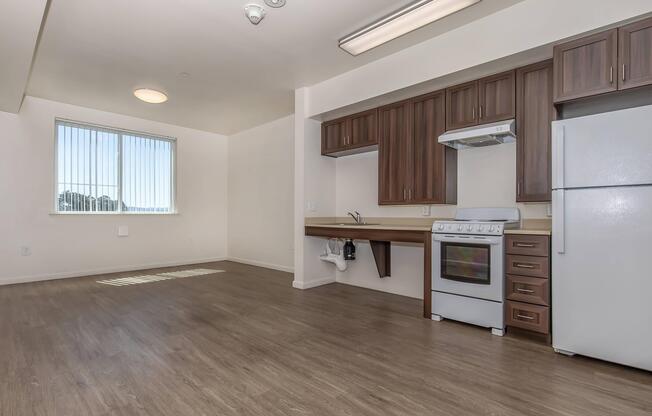 a kitchen with a wood floor