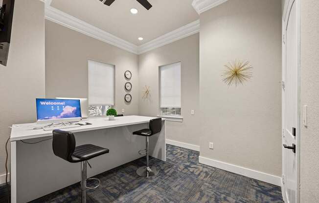 A room with a desk and a computer on it.