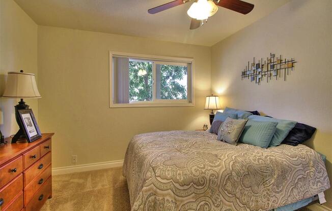 comfortable bedroom with ceiling fan  at The Arbors at Mountain View, Mountain View, CA