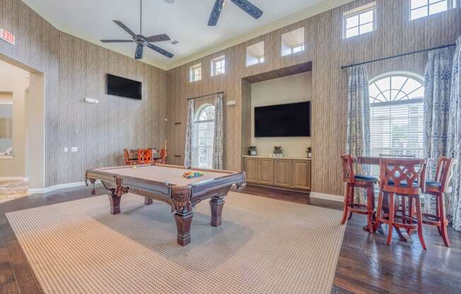 clubhouse with billiards table and TVs