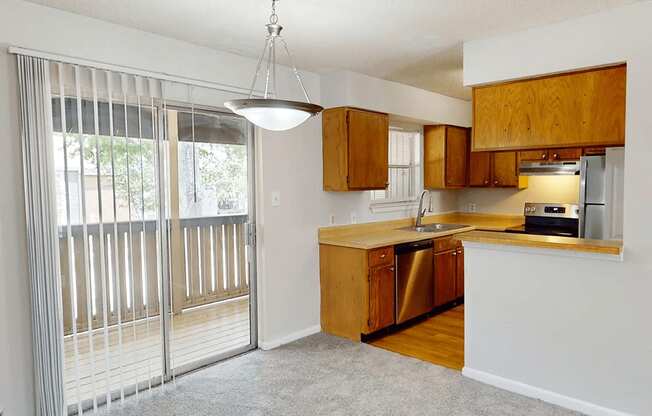 A kitchen with wooden cabinets and a dishwasher.