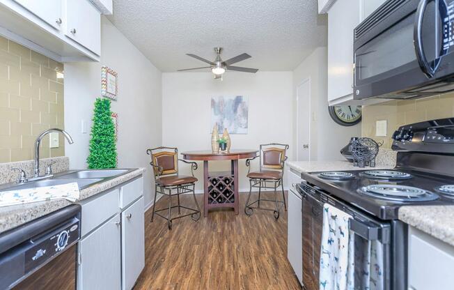 a kitchen with a stove and a sink