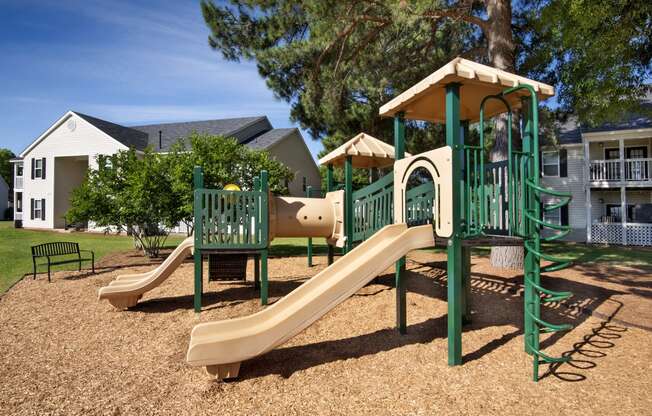 the playground at the preserve at polk apartments with a slide