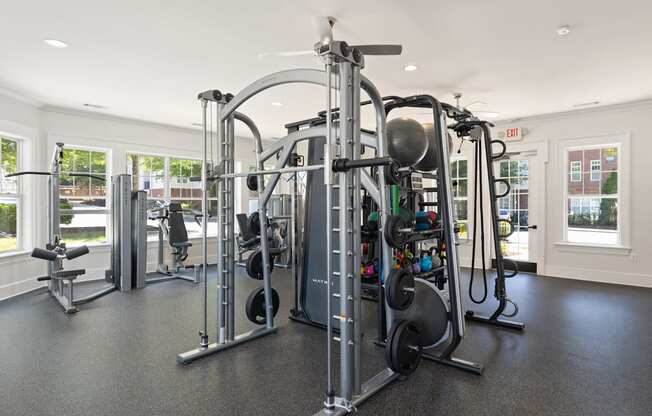 A gym with a variety of equipment including a leg press machine.