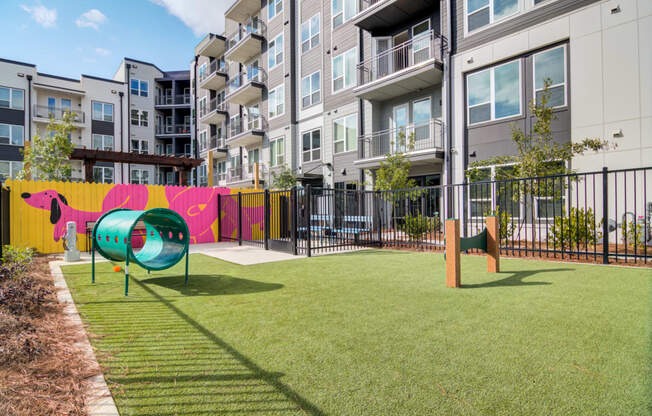 a playground in front of an apartment building