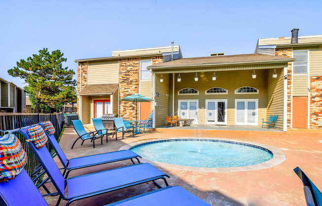 the private pool and jacuzzi in the backyard of a house