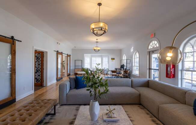 a living room with a couch and a rug