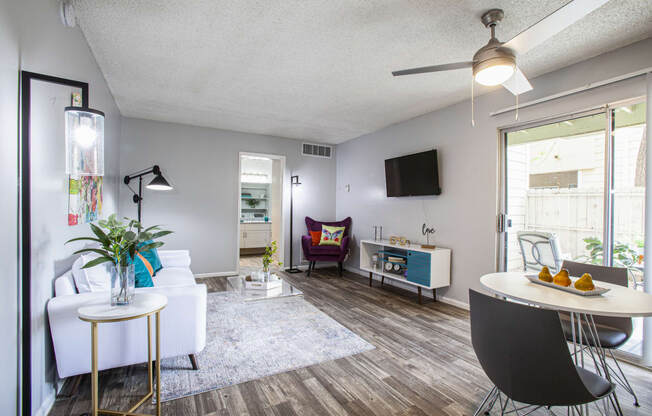 a living room with a couch and a table and a tv