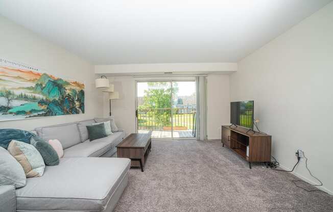 Spacious and cozy living room at Cambridge Club Apartments in Ann Arbor, Michigan