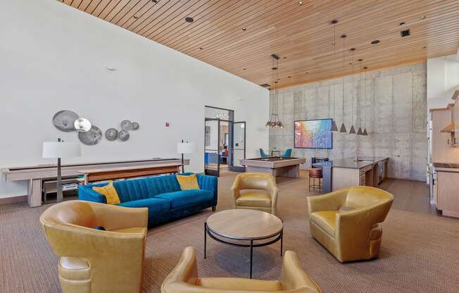 a living room filled with furniture and a pool table